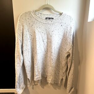 White sweater with black and gray specks